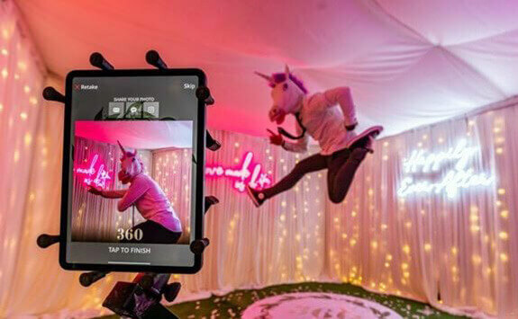 Two people having fun at the Social Photo Booth.