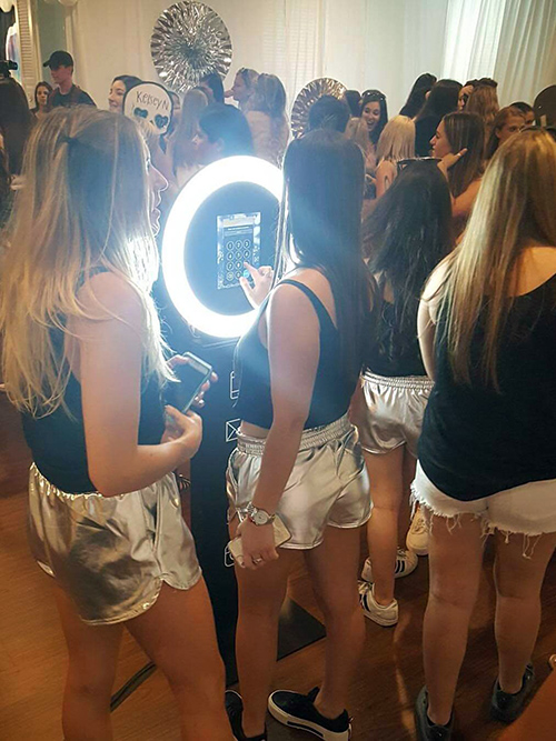 Guests having fun at the Social Photo Booth.